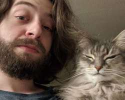 He is a cat lover and has a cute one in his home.